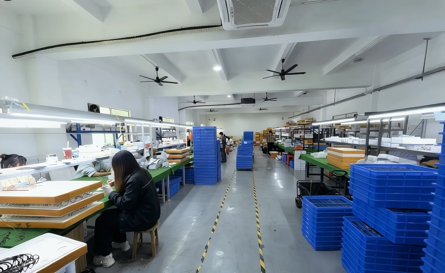 Wide view of eyewear workshop benches and production stations